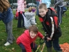 Children planting bulbs in the park